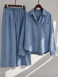 Elara Muse light blue denim button-down shirt and wide-leg palazzo displayed on wooden hangers